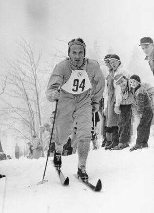 old man skiing in odlo clothes