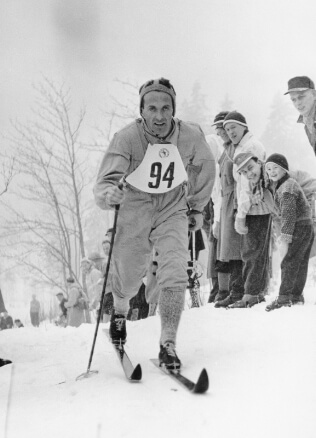 old man skiing in odlo clothes